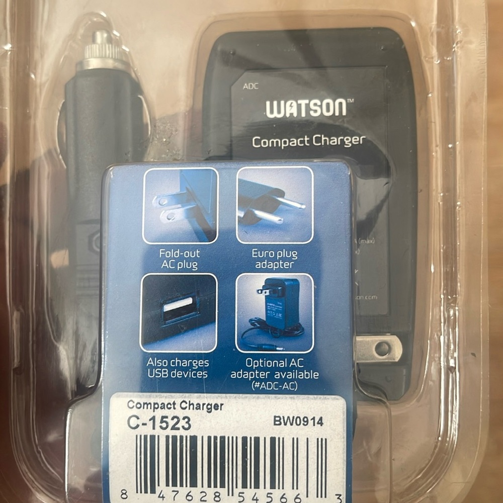 One black Watson ADC compact charger.